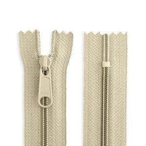 May include: A beige zipper with a metal slider and a YKK logo. The zipper is open and the slider is in the middle of the zipper.
