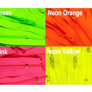 May include: A close-up image of four different colors of zipper tape. The colors are neon green, neon orange, neon pink, and neon yellow. The zipper tape is arranged in a grid pattern.