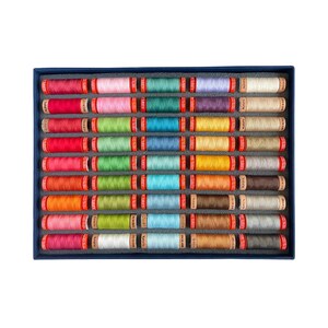 May include: A blue box filled with 40 spools of colorful thread. The spools are arranged in rows and are all the same size. The thread is a variety of colors, including red, orange, yellow, green, blue, purple, and pink.