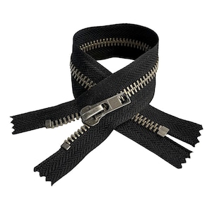 May include: A black zipper with a silver-colored metal pull and teeth. The zipper is shown in a looped configuration against a white background. The zipper's teeth are interlocked, and the pull is in the closed position.