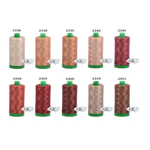 May include: Ten spools of thread in various shades of brown, pink, and red. The spools are labelled with numbers from 2326 to 2372.