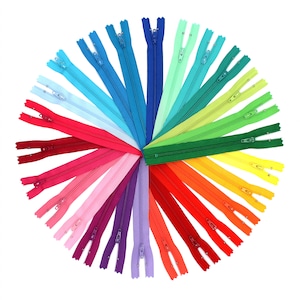 May include: A rainbow assortment of 24 zipper closures arranged in a circle. The zippers are all the same length and have a silver slider.