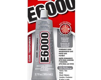 May include: A tube of E6000 industrial strength adhesive, clear and transparent, with a red and white label. The tube contains 3.7 fl oz (109.4 mL) of adhesive and is suitable for fabric, metal, wood, and ceramic.