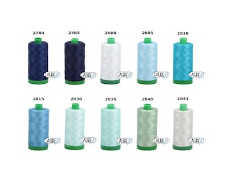 May include: Ten spools of thread in various shades of blue and green. The spools are labeled with numbers from 2784 to 2843.