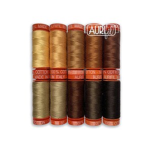 May include: A set of eight spools of Aurifil thread in shades of brown and beige. The spools are labeled "100% Cotton" and "Aurifil Made in Italy".