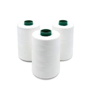 May include: Three spools of white thread with green plastic tops.