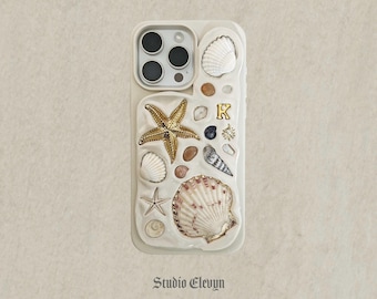 Coastal | Customizable Seashell Mosaic Phone Case. Each Item is Meticulously Handcrafted with High Quality Charms, Shells, and Pearls.