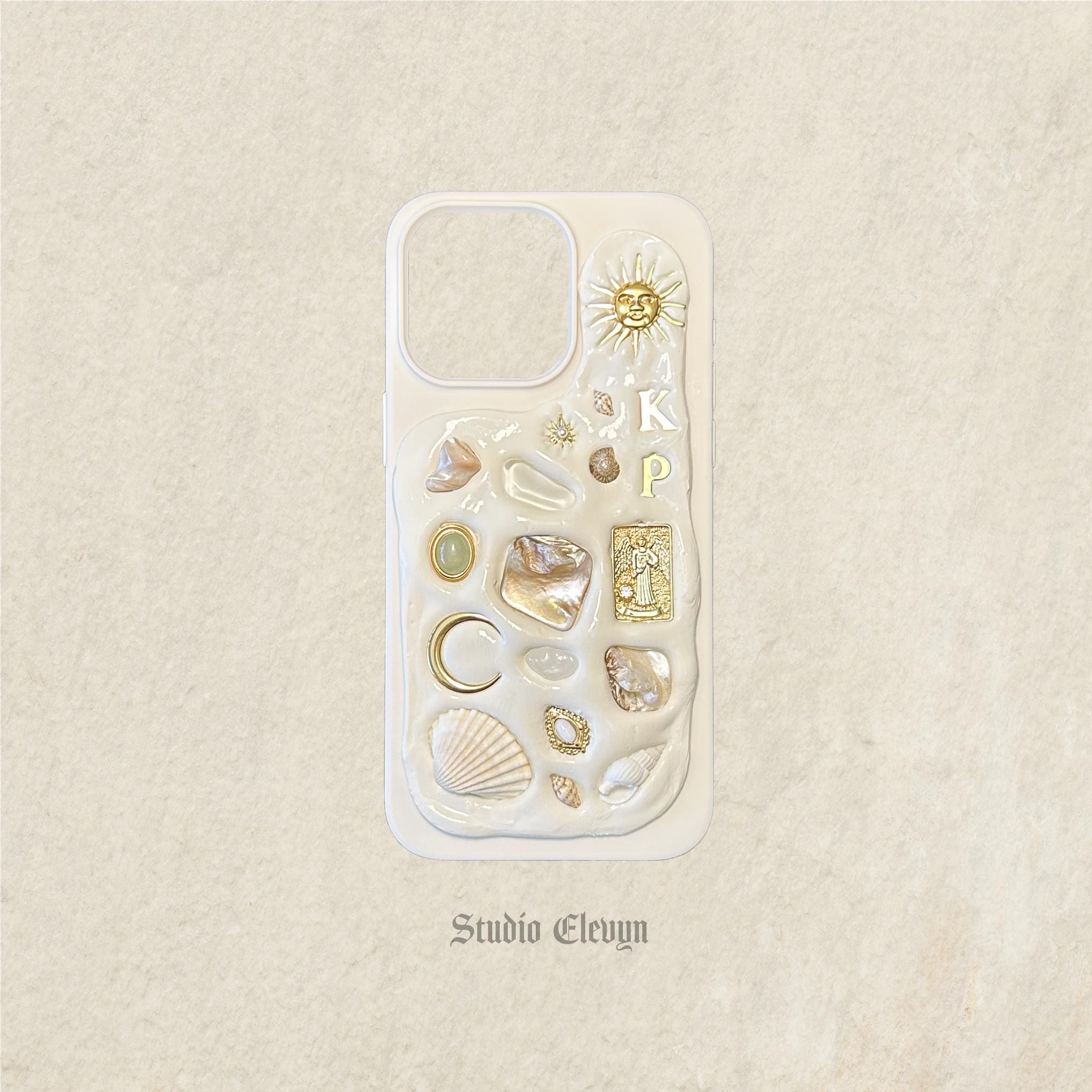 Celestial | Customizable Mosaic Phone Case. Each Item is Meticulously Handcrafted and Made with High Quality Charms, Shells, and Pearls.