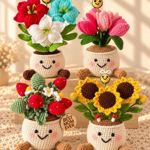 May include: Four crocheted potted plants with smiling faces, pink cheeks, and brown feet. The plants include red, white, and blue lilies with a bee, pink tulips with a bee, red strawberries with white flowers, and yellow sunflowers with a bee and mushrooms. A wooden tag reads BEST MOM EVER.
