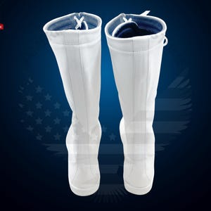 May include: A pair of white knee-high boots with a lace-up front and a blue lining. The boots are made of a smooth, leather-like material.