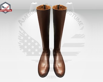 May include: A pair of brown leather knee-high boots with a zipper on the inside of each boot.