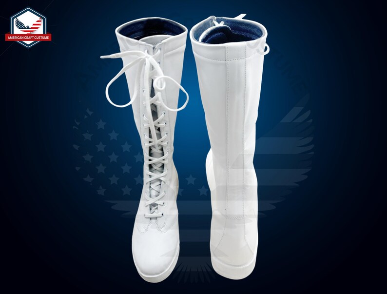 May include: A pair of white knee-high boots with lace-up fronts. The boots have a blue lining at the top.