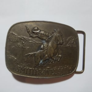 Brass plate on the belt Smith and Wesson