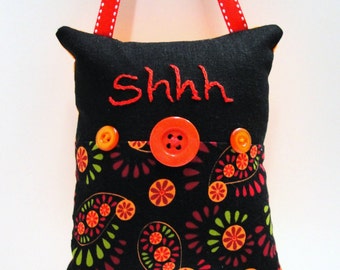 Shhh pillow- doorknob pillow hand embroidered in red on black, orange, red and green with button embellishments