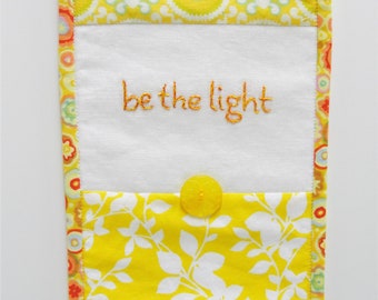 hand embroidered mini wall hanging- yellow and orange floss white linen with yellow, aqua, white, "be the light" ready to ship