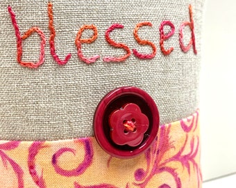 hand-embroidered pillow - "i am blessed”on natural linen with magenta scrolls on yellow-orange,  meditation, affirmation, Ready to Ship
