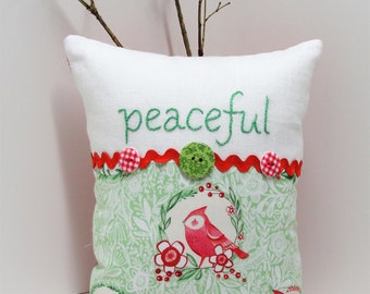 Christmas pillow- hand -embroidered "peaceful" on linen with woodland Christmas print, buttons and rick rack READY TO SHIP