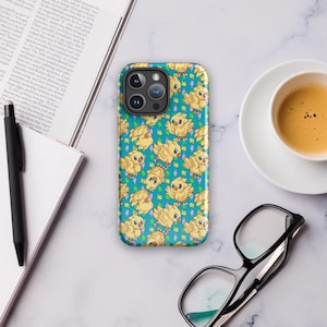 May include: A turquoise blue phone case with a repeating pattern of yellow cartoon birds with light blue wings and green leaves. The phone case has a black camera lens.