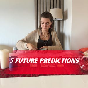 May include: A woman seated at a table with tarot cards laid out on a red cloth. The text "5 FUTURE PREDICTIONS" is displayed across the bottom of the image. A candle and a decorative bottle are also on the table.