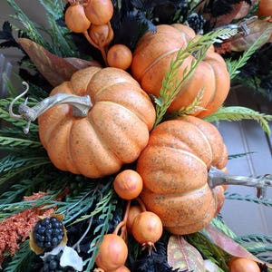 Orange pumpkins for fall front door decor