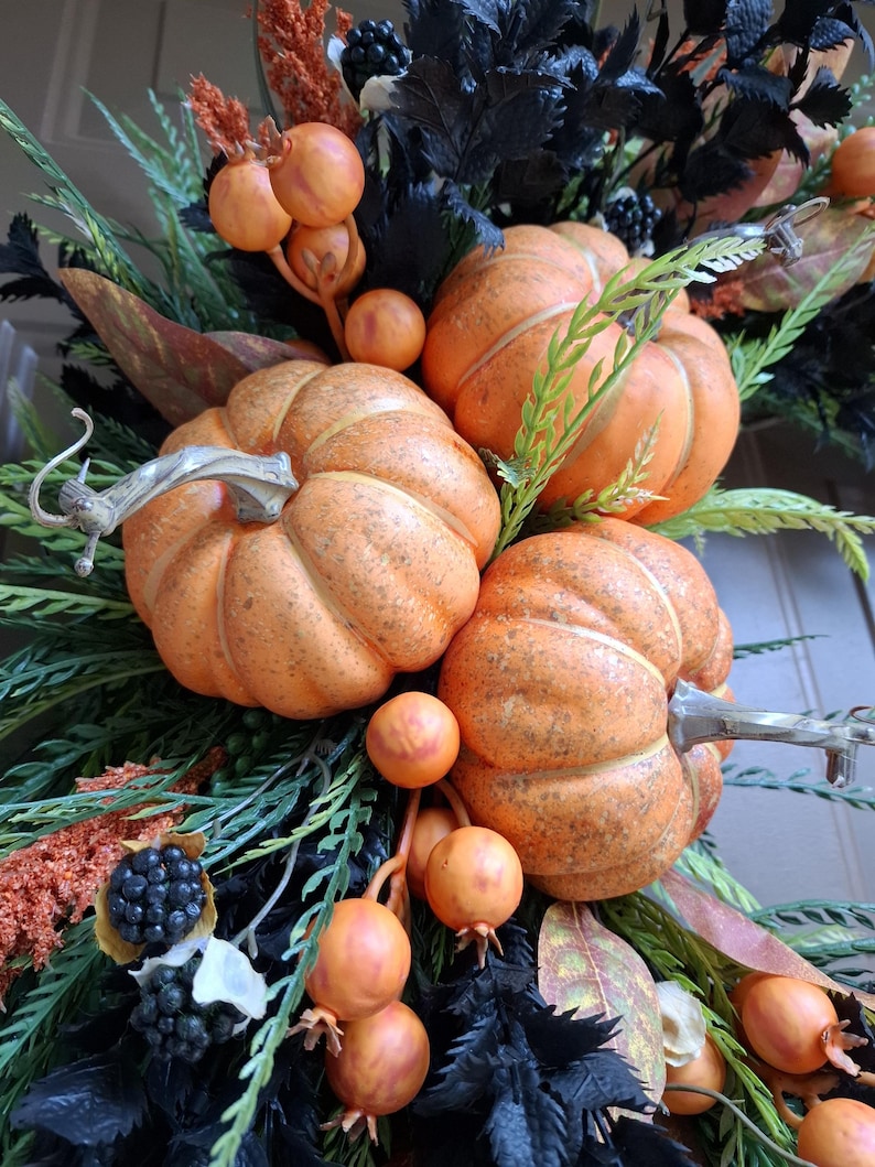 Orange pumpkins for fall front door decor