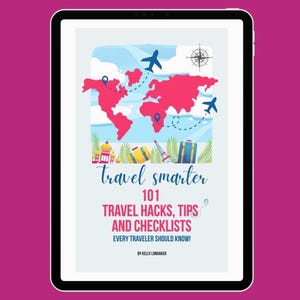 May include: A tablet displays a travel guide cover with a world map in pink, airplanes, and travel icons. The title reads "Travel Smarter" with the text "101 Travel Hacks, Tips and Checklists Every Traveler Should Know!" by Kelly Longaker.