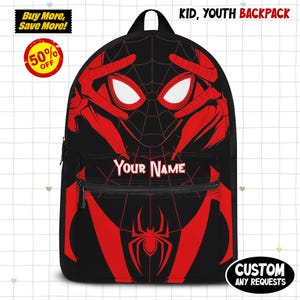 May include: Black backpack with a red Spider-Man design. The backpack features a large graphic of Spider-Man's face and web pattern. The text "YOUR NAME" is displayed on the front pocket. Additional text includes "KID, YOUTH BACKPACK" and "CUSTOM ANY REQUESTS".
