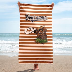 May include: A brown and white striped beach towel with a cartoon character holding a hook. The text "Your name" is printed on the towel.