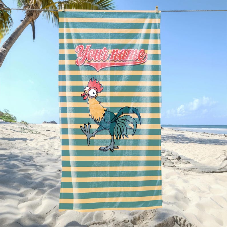 May include: A beach towel with a green and yellow striped pattern. The towel features a cartoon rooster with a red comb and wattle, and the text "Your name" in a red, white, and blue arc.