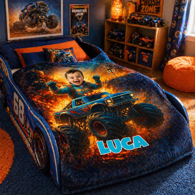 May include: A blue race car-shaped bed frame featuring a plush blanket printed with a child driving a monster truck amidst flames. The blanket displays the name LUCA in large blue letters. The bed includes a matching pillow with a monster truck graphic.