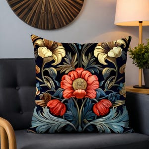 May include: A decorative cushion with a floral pattern. The cushion features a dark blue background with red, yellow, and green flowers.