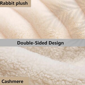 May include: Close-up of a double-sided plush material. The top section is labeled "Rabbit plush" and features a soft, light beige texture. The bottom section, labeled "Cashmere," has a textured, off-white appearance.