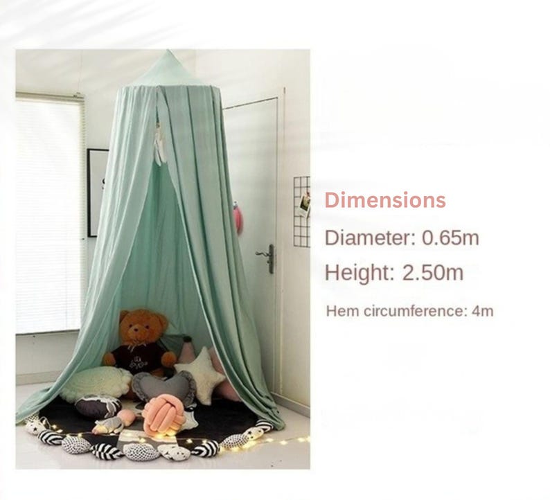 May include: A mint green canopy with a diameter of 2.13 feet and a height of 8.2 feet. The hem circumference is 13.12 feet. The canopy is draped over a black mat with decorative pillows and a teddy bear inside.