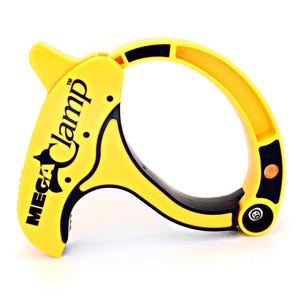 May include: A yellow and black Mega Clamp tool. The tool features a curved handle and a clamping mechanism. The text "MEGA Clamp" is printed on the side. It's designed for various clamping applications.