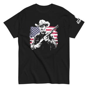 Patriotic Cowboy Marksman Shirt Black | USA Flag Graphic Tee Black | American Pride Shirt Black | Hunting Trip Tee Black | Cool Dad Tee Black | American Flag Shirt Black