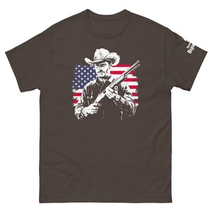 Patriotic Cowboy Marksman Shirt Chocolate | USA Flag Graphic Tee Chocolate | American Pride Shirt Chocolate | Hunting Trip Tee Chocolate | Cool Dad Tee Chocolate | American Flag Shirt Chocolate