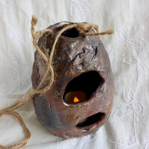 Outdoor decor, bird’s nest, candleholder, pottery, handmade, stoneware, Raku, iridescent blues, golds, greens, reds, 6"h x 4 1/2” w x 2 1/2" bild 1