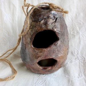 Outdoor decor, bird’s nest, candleholder, pottery, handmade, stoneware, Raku, iridescent blues, golds, greens, reds, 6"h x 4 1/2” w x 2 1/2" bild 2