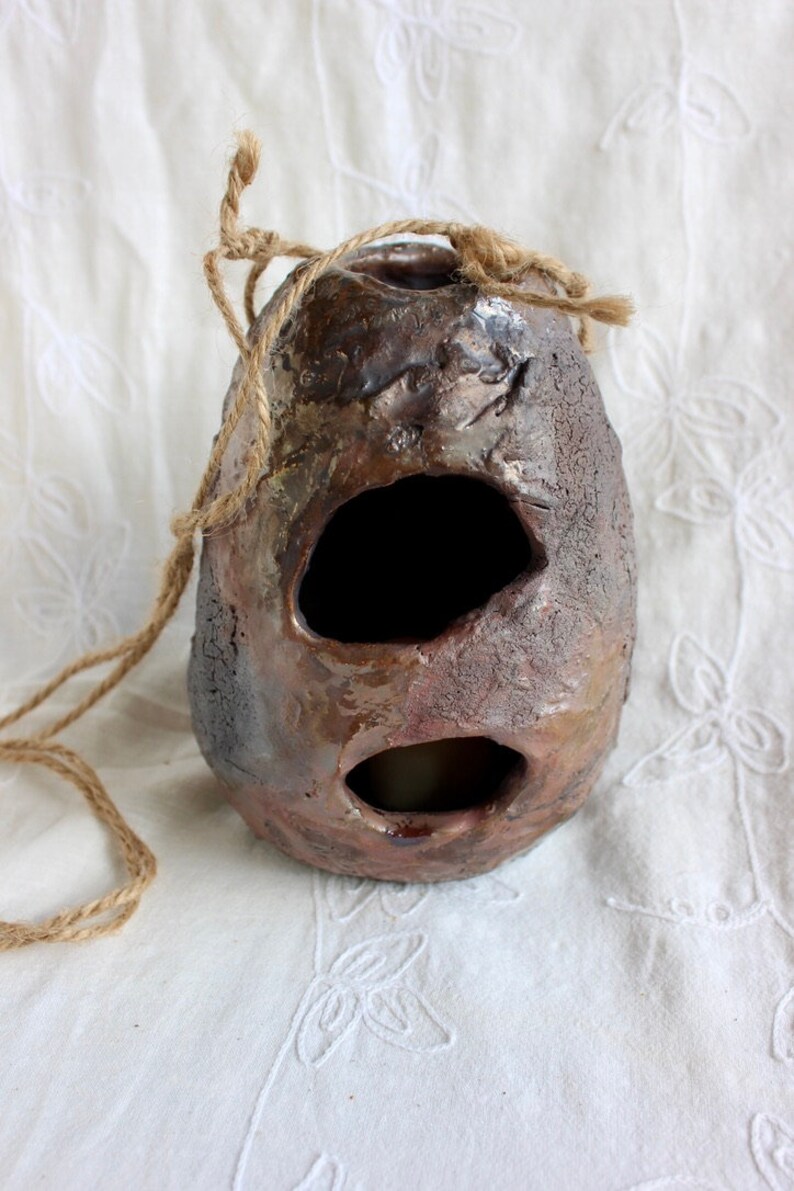 Outdoor decor, bird’s nest, candleholder, pottery, handmade, stoneware, Raku, iridescent blues, golds, greens, reds, 6"h x 4 1/2” w x 2 1/2" bild 2