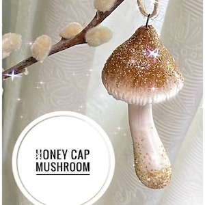 Honey brown mushroom ornament with sparkly top, conical, hanging from pussy willow branch