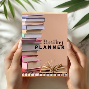 May include: A Reading Planner with a stack of colorful books on the left and an open book at the bottom. The planner has the words "Reading PLANNER" in black. The background is a light peach color.