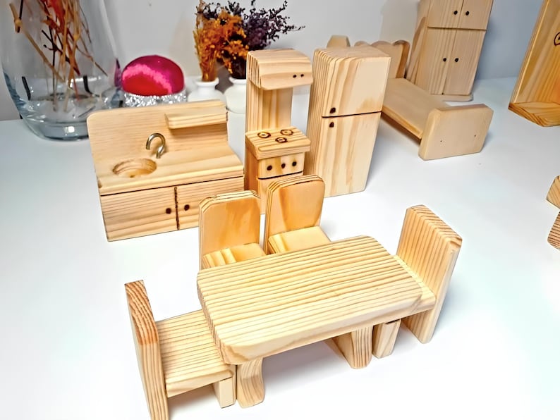 May include: A wooden dollhouse kitchen set with a sink, stove, refrigerator, table, and four chairs. The set is made of unfinished wood and is ready to be painted or stained.