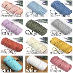 May include: A collection of 12 spools of cotton cord in various colors, including powder pink, baby blue, navy blue, lilac, green, gray, copper, cream, yellow, mint, white, and rose.