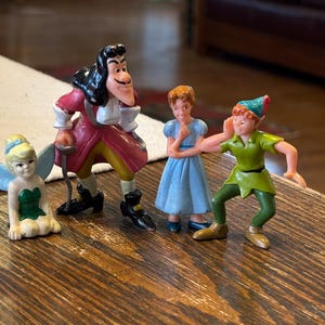 Vintage Disney’s Peter Pan, Wendy, Captain Hook, and Tinker Bell PVC Toys