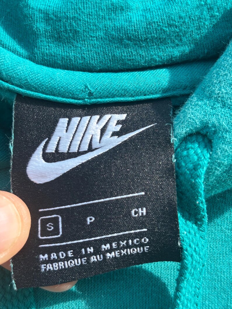 May include: A set of three ceramic mugs with a speckled, matte finish in cream, light grey, and dark grey. Each mug has a simple, minimalist design and a rounded handle.