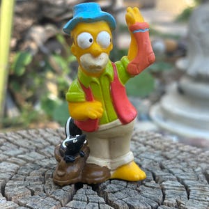 Vintage 1990s Burger King Kids Club Simpson’s Toy: Homer Simpson Fishing with Skunk