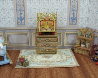 May include: A miniature dollhouse room with a wooden dresser, a toy rocking horse, and a miniature circus stage with the word "CIRCUS" printed on it. The room is decorated with a blue and white patterned wallpaper.