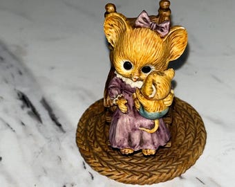 mouse holding baby