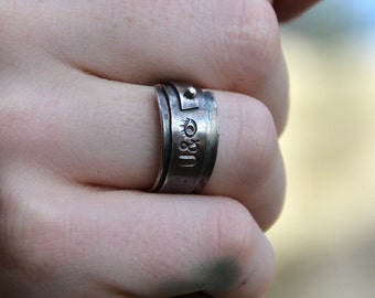 Stamped Sterling Silver ring with rustic black oxidized silver band