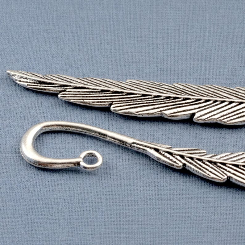 Silver feather bookmarks with engraved details and curved hooks; zinc alloy metal, DIY bookmark kit 5-pack.